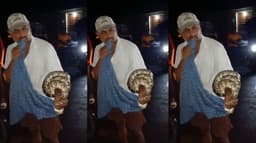 சாலையில் ஊர்ந்துசென்ற 7 அடி மலைப்பாம்பைப்  பிடித்த கூலித் தொழிலாளி